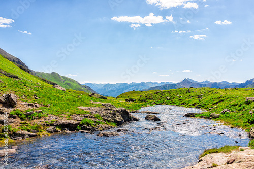 Принти на полотні Landscape view of green grass and Ice lake river runoff water flowing near Silve