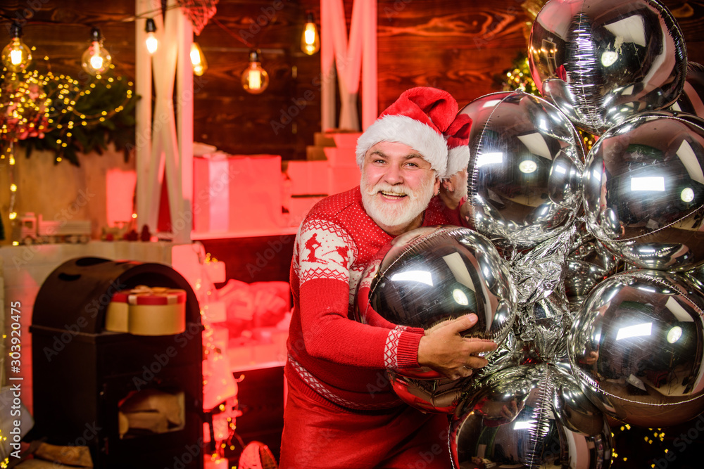 Christmas gift. Celebrate new year. December sale. Santa Claus delivering gift. Surprise concept. Man senior Santa claus hold gift box silver air balloons decor. Gift shop. Presents for family Christmas gift. Celebrate new year. December sale. Santa Claus delivering gift. Surprise concept. Man senior Santa claus hold gift box silver air balloons decor. Gift shop. Presents for family