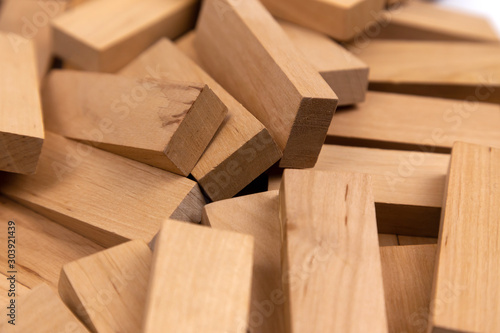 The texture of a pile of wooden blocks that lie randomly. Background.