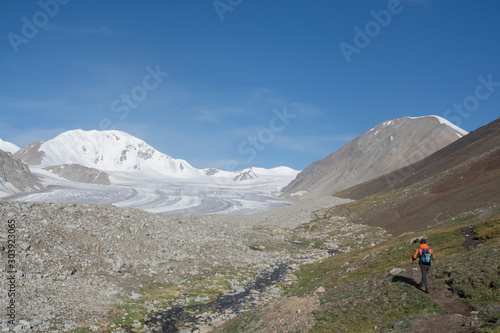 Man Hiking in Malchin Peak in Altai mountains, Mongolia © urdialex