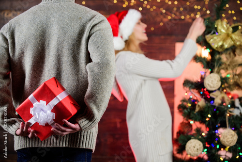Generosity and kindness. Prepare surprise. Winter surprise. Man carry gift box behind back defocused background. Christmas surprise concept. Surprising his wife. Giving and sharing. Surprise effect