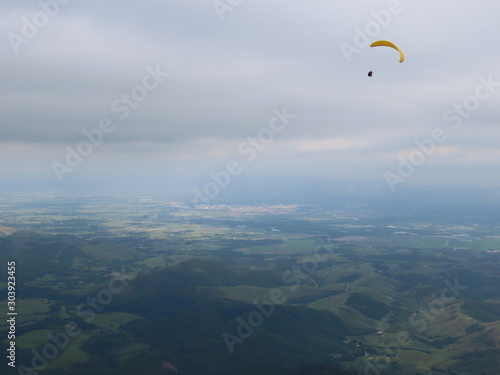 paraglider flight in cloudy day