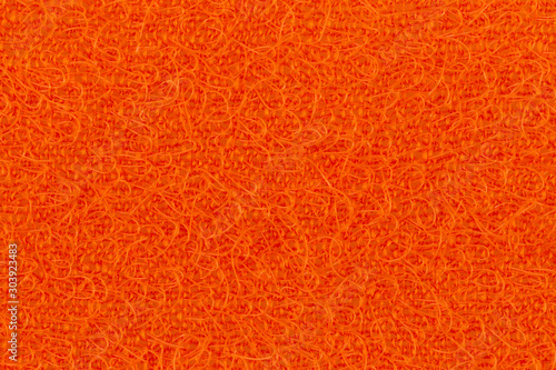 Abstract texture of the orange surface washcloths for washing dishes macro close-up background