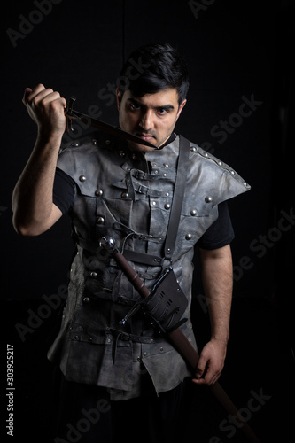 Medieval or fantasy character with weapons