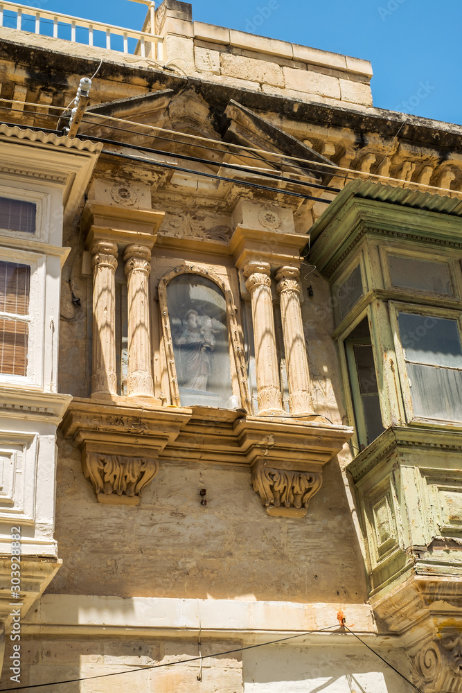 Sliema Malta, July 16 2019. Traditional Maltese architecture in Sliema Old Town in Malta, street with traditional balconies and old buildings in historical city of Malta. Sliema Malta, July 16 2019. Traditional Maltese architecture in Sliema Old Town in Malta, street with traditional balconies and old buildings in historical city of Malta.