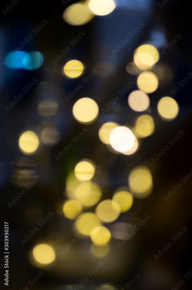 Obraz premium burning colored lights garlands on the background, blurred, out of focus, bokeh