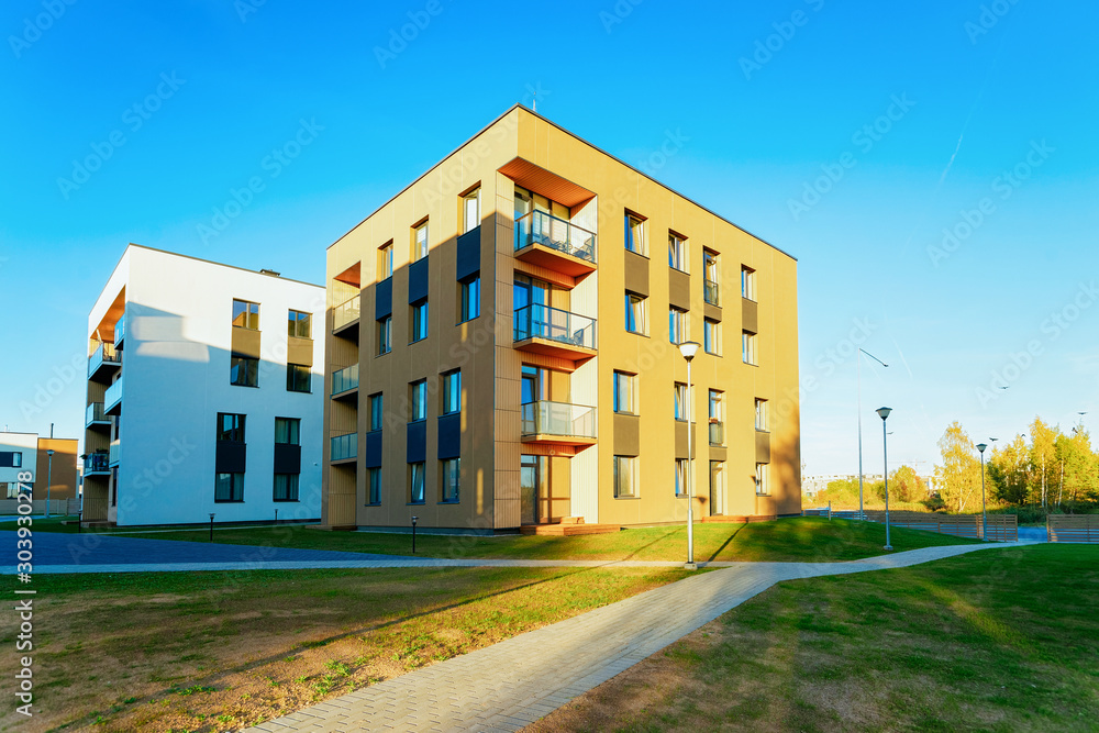 Residential Apartment home facade architecture with outdoor facilities. Blue sky on the background.