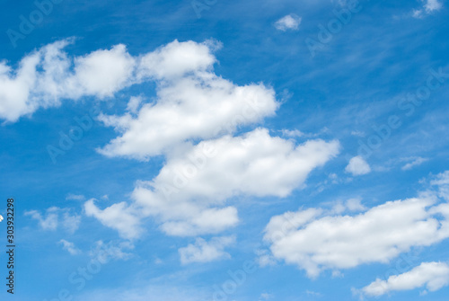 the sun shining through the clouds against the blue sky, light clouds in the sky