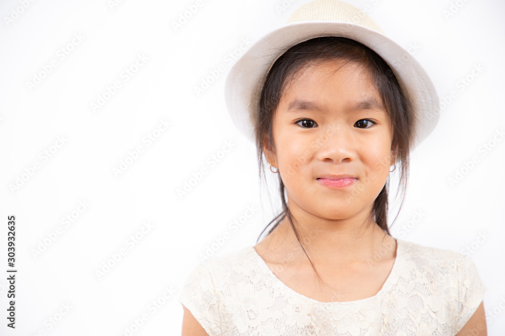The Asian girl is smiling, happy with her favorite dress in a white background. The Asian girl is smiling, happy with her favorite dress in a white background.