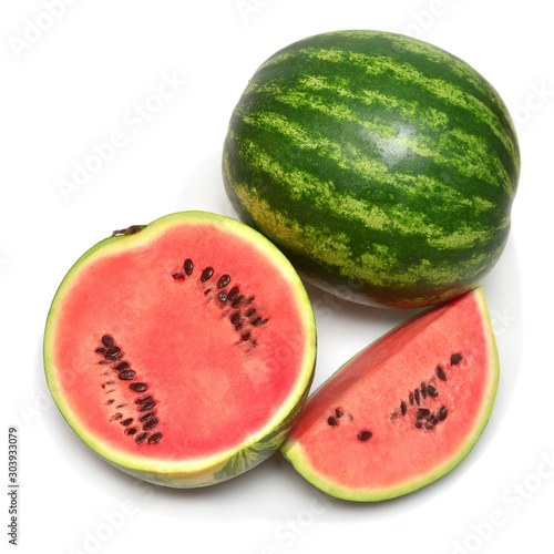 Watermelon whole, half and slices isolated on a white background. Top view, flat lay