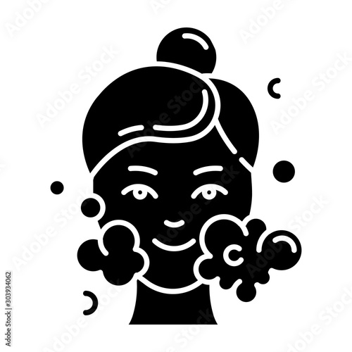Water face cleanser glyph icon. Skin care procedure. Facial beauty treatment. Foam and bubbles. Cleansing and moisturizing effect. Silhouette symbol. Negative space. Vector isolated illustration