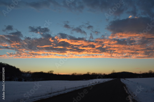 Winter Sunset Over Rural Road