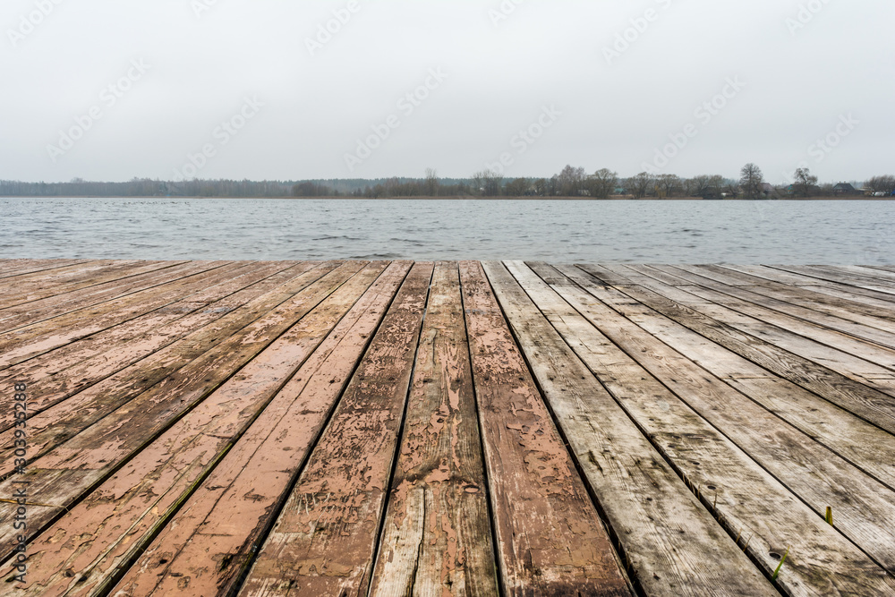Wooden board lake with autumn forest and lake Wooden board lake with autumn forest and lake