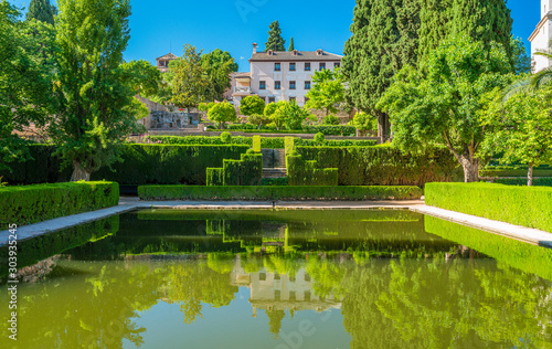Idyllic garden in the Alhambra Palace of Granada. Andalusia, Spain.