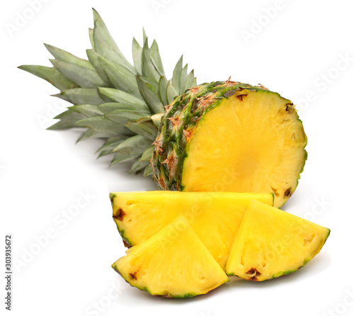Pineapple fruit with slices isolated on a white background. Top view, flat lay