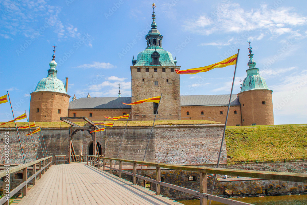 Fototapeta premium The main attraction of the city is the medieval stone Kalmar Fortress with tourists. In the province of Smaland in Sweden. one of Sweden's best preserved renaissance castles