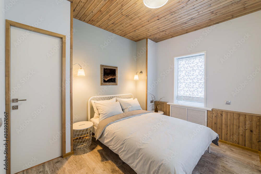 Luxurious stylish and cozy bedroom interior in the house.