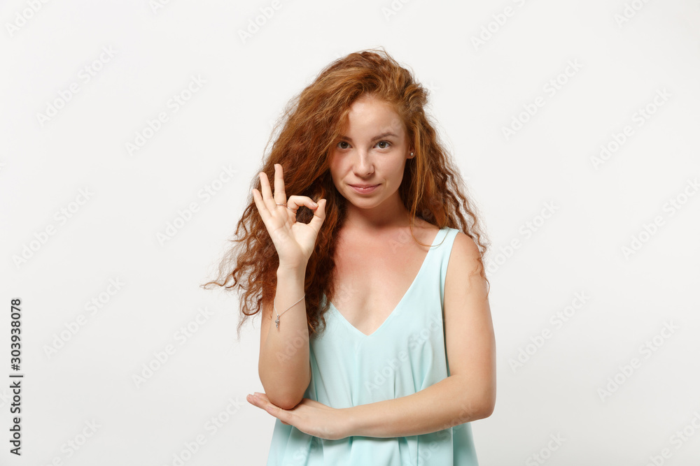 Young beautiful redhead woman girl in casual light clothes posing isolated on white wall background, studio portrait. People sincere emotions lifestyle concept. Mock up copy space. Showing OK gesture. Young beautiful redhead woman girl in casual light clothes posing isolated on white wall background, studio portrait. People sincere emotions lifestyle concept. Mock up copy space. Showing OK gesture.