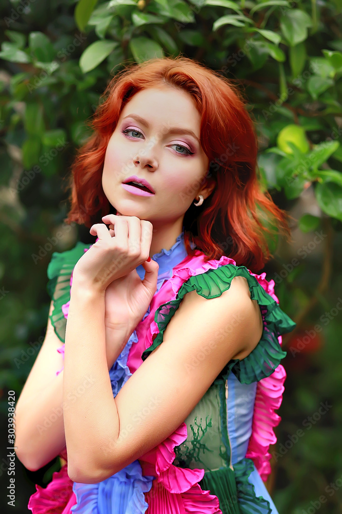 beautiful red-haired girl in arranger where azalea blooms in a colorful flying dress beautiful red-haired girl in arranger where azalea blooms in a colorful flying dress