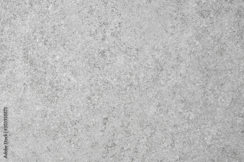 Close up of light grey slate tile background with speckled design.