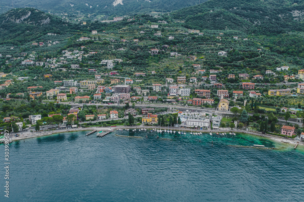 Aerial drone shot view of village Malcesine coastline by lake garda
