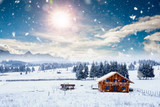 Fairy-tale winter landscape and cottage in woods at winter. Christmas concept.