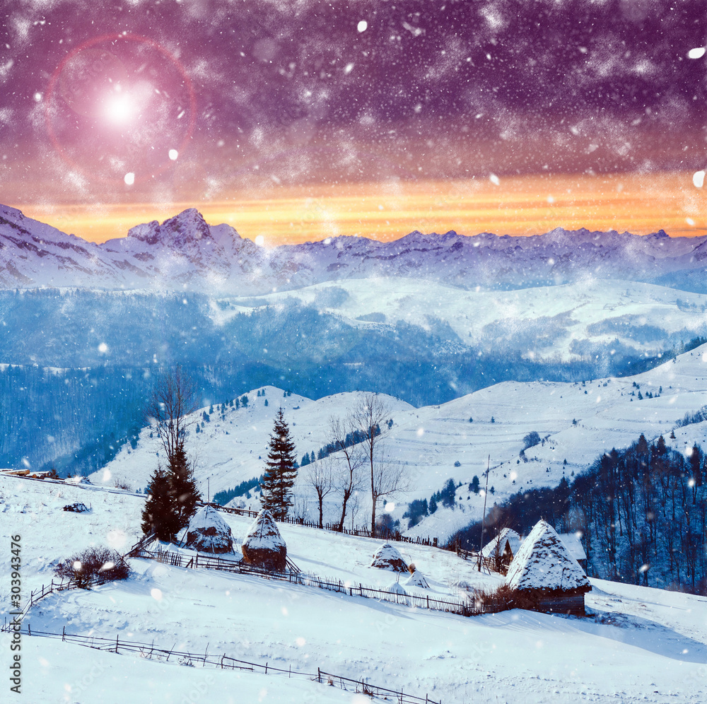 Winter postcard of cottage in the mountains at sunrise. Christmas concept.
