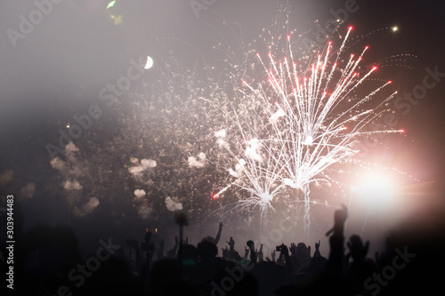 Crowd and fireworks. Celebrations and New Years Eve concept. 