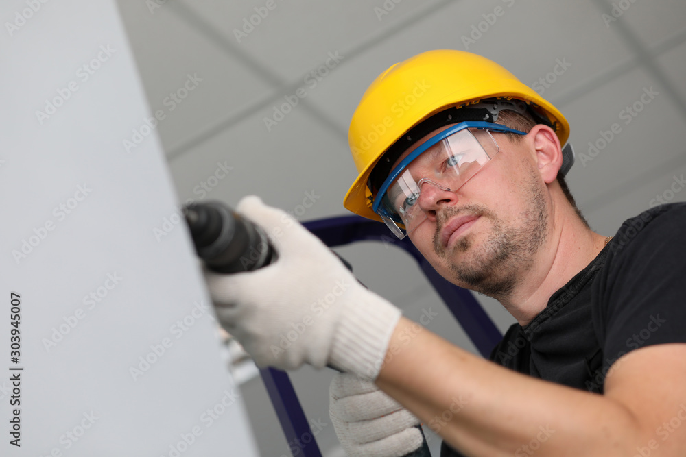 Worker with drilling machine Worker with drilling machine