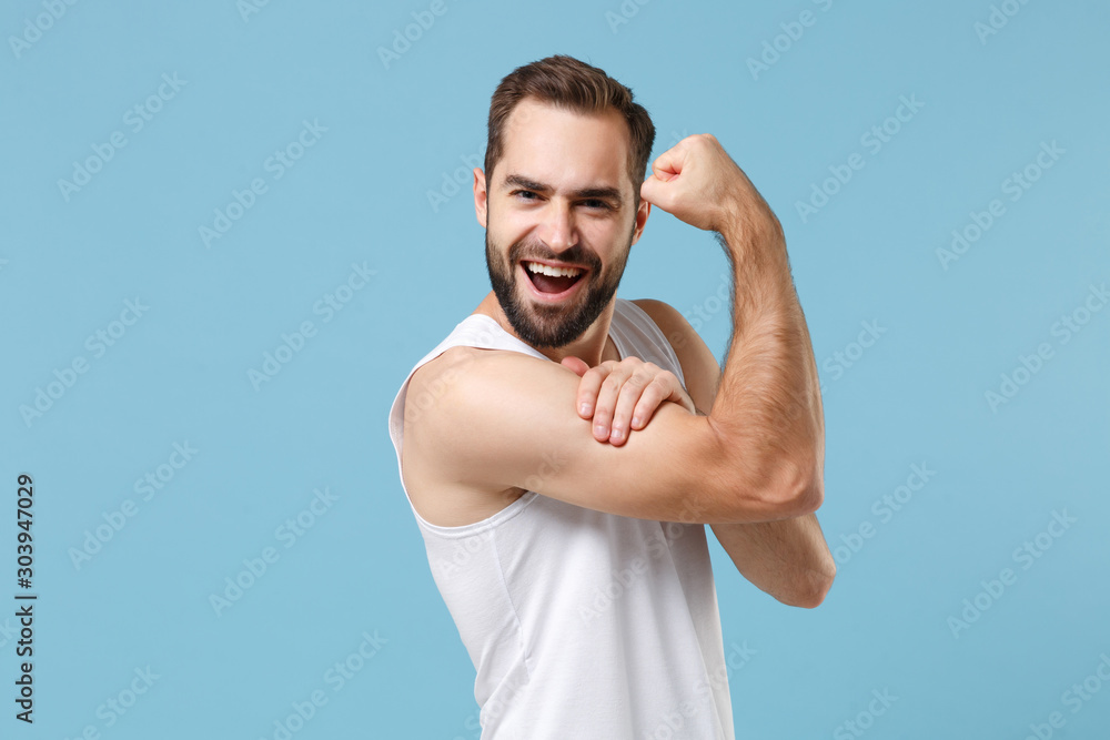 Close up bearded young man 20s years old perfect skin wearing white shirt isolated on blue pastel wall background, studio portrait. Skin care healthcare cosmetic procedures concept. Mock up copy space Close up bearded young man 20s years old perfect skin wearing white shirt isolated on blue pastel wall background, studio portrait. Skin care healthcare cosmetic procedures concept. Mock up copy space