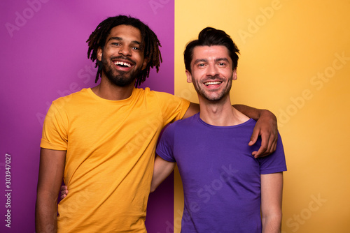 Blank and white friends. Concept of integration, union and partnership. Yellow and violet background