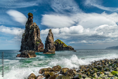 Tall lava rocks in ocean, islet towers in Ribeira da Janela, Madeira, Portugal