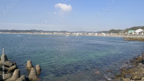 The seashore of Kamakura Japan. Touristic region facing the pacific ocean with beaches and mountains. photo