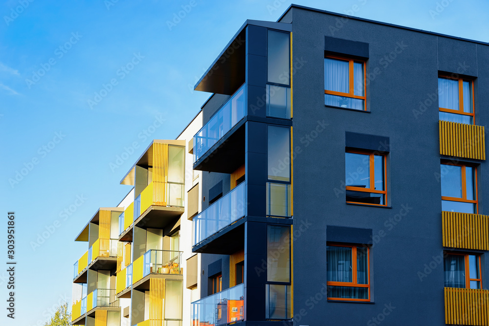 Residential apartment house facade and a blank place for the copy space. Blue sky on the background. Residential apartment house facade and a blank place for the copy space. Blue sky on the background.