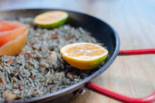 black paella, rice with squid - spanish cuisine