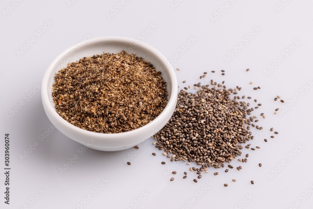 Chia seeds isolated on white background, angle view, copy space, studio shot, soft light. Latin name (Salvia hispanica). Chia seeds isolated on white background, angle view, copy space, studio shot, soft light. Latin name (Salvia hispanica).