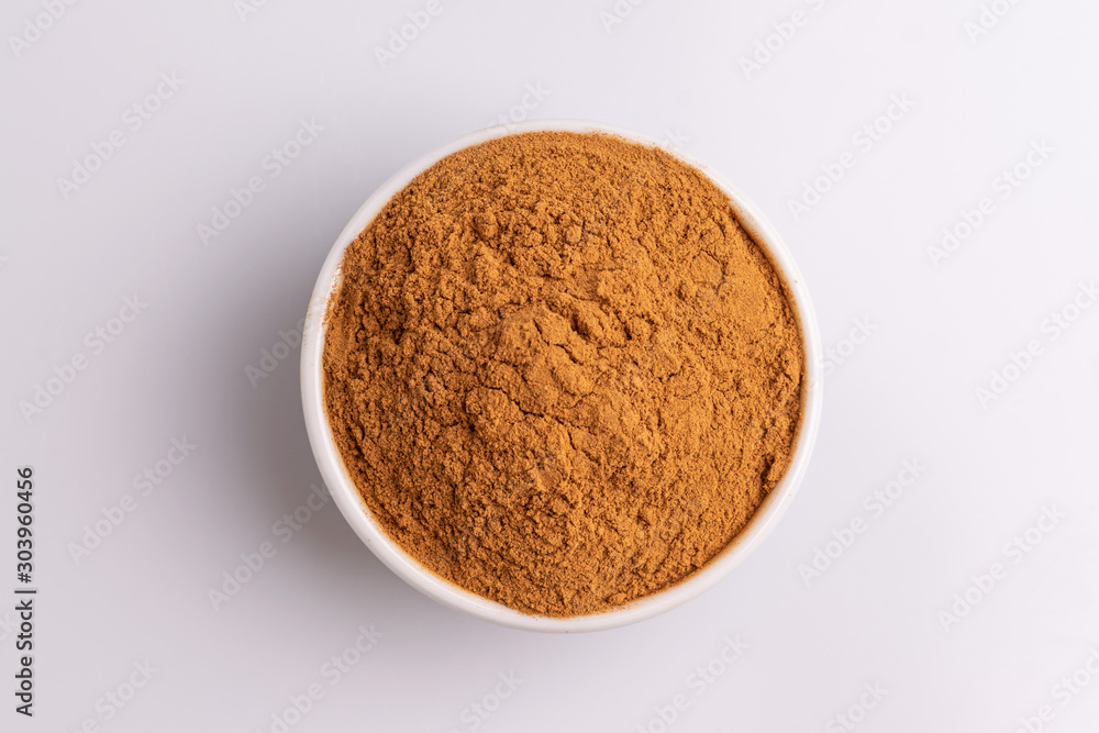 Cinnamon powder isolated on white background, copy space, studio shot, soft light, top view. Latin name Cinnamomum cassia Cinnamon powder isolated on white background, copy space, studio shot, soft light, top view. Latin name Cinnamomum cassia