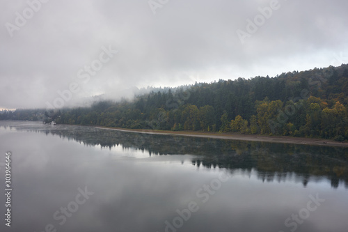 Willamette River viewed from Sellwood Bridge in Portland on a misty fall morning. © Tada Images