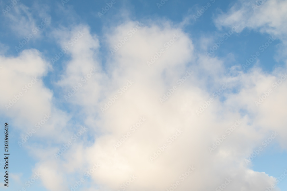 Blue sky with white clouds. Cloud background with color gradient and grunge texture. Blue sky with white clouds. Cloud background with color gradient and grunge texture.