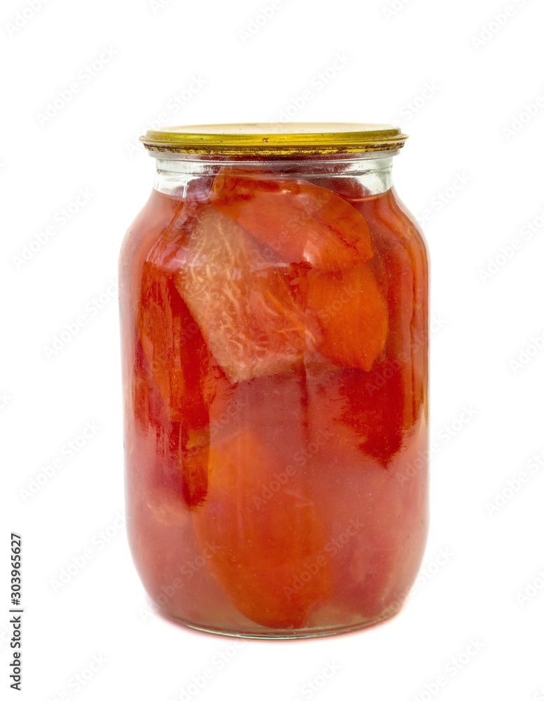 Glass jar with canned tomatoes isolated on a white background. Glass jar with canned tomatoes isolated on a white background.