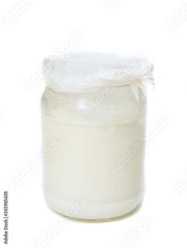 Glass jar with white dairy product