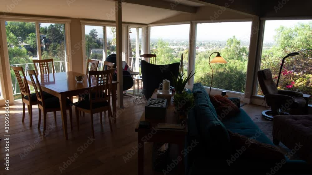 Timelapse of the day passing and shadowns moving across a nice house looking out across a valley during sunset. Timelapse of the day passing and shadowns moving across a nice house looking out across a valley during sunset.