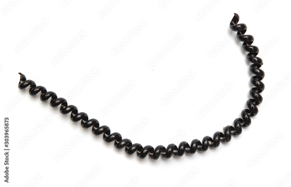 Black curly cord wire, on a white background. Black curly cord wire, on a white background.