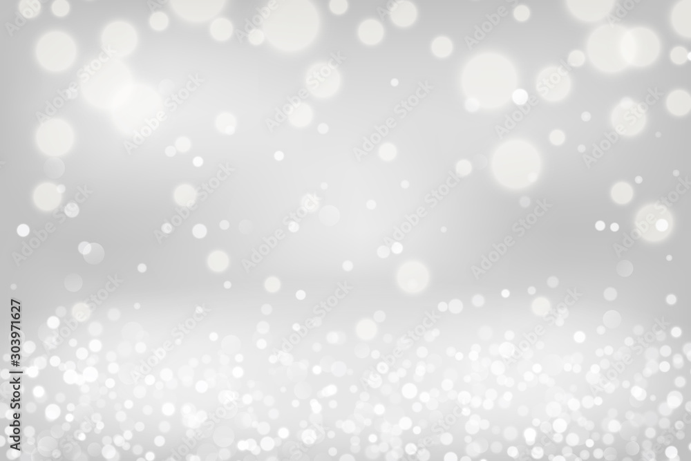 Silver bokeh background. Christmas glowing lights with sparkles. Holiday decorative effect.