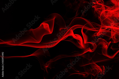 Red smoke abstract on black background, movement of fire