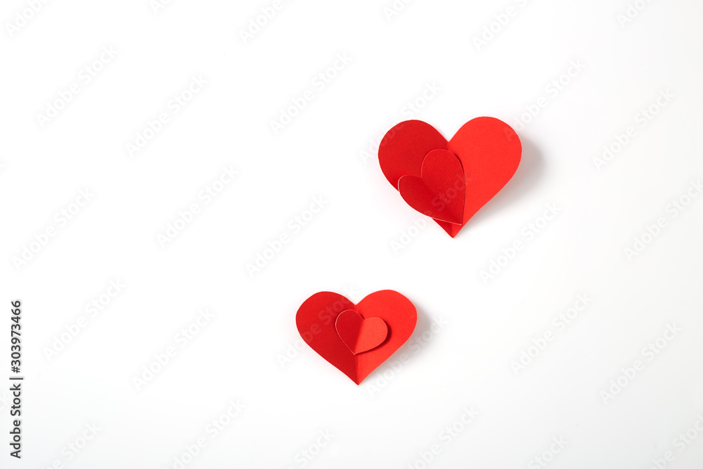 Red paper hearts on white background