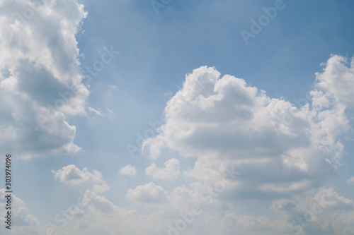 fluffy white cloud on clear blue sky