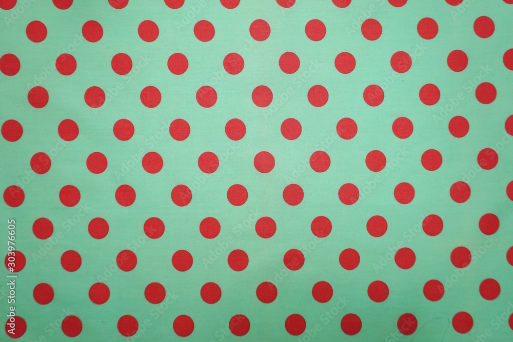 Green with pink polka dot pattern background