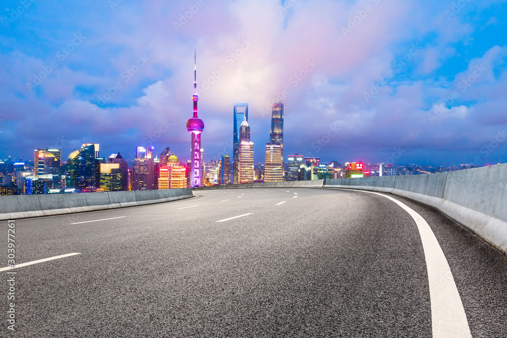 Asphalt highway and beautiful cityscape in Shanghai at night.