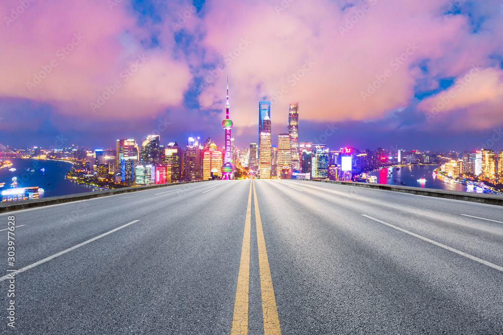 Asphalt highway and beautiful cityscape in Shanghai at night.